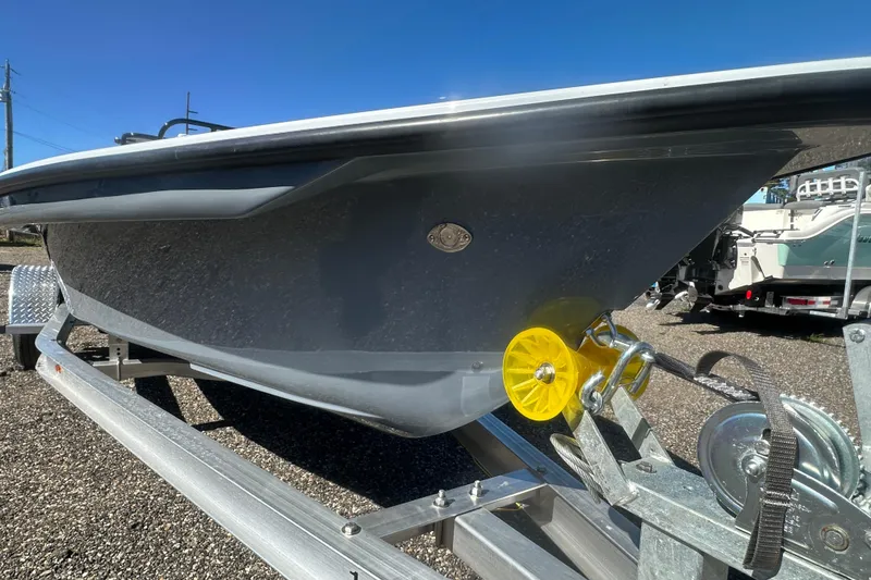 Slide: The Image of 2026 Delta Boatworks Delta D18 on trailer, showcasing sleek hull design under clear blue sky. - 30