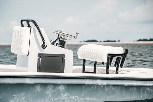 Slide: The Image of 2026 Delta Boatworks Delta D18 on trailer, displayed outdoors at a boat dealership. - 6