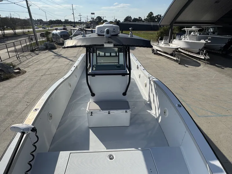 Slide: The Image of 2005 FinCat 35 boat with Garmin equipment, docked outdoors under a clear sky. - 12