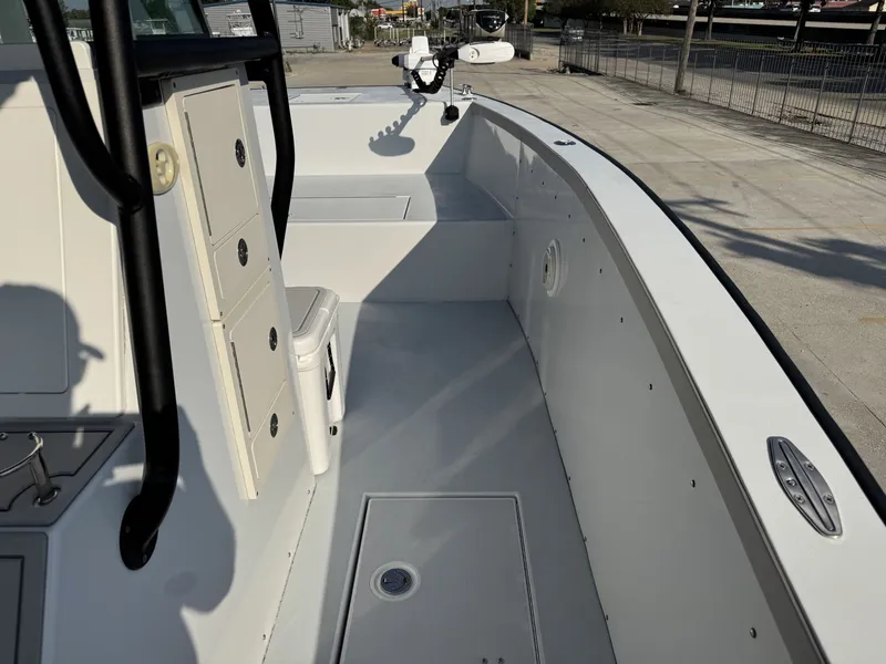 Slide: The Image of Interior view of a 2005 FinCat 35 boat, showcasing seating and storage compartments. - 24