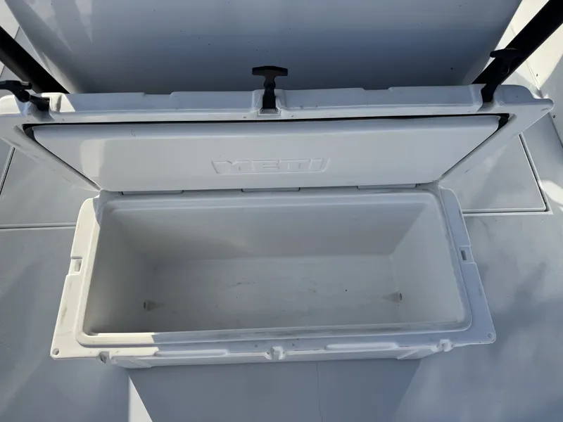 Slide: The Image of Open YETI cooler on FinCat 35 boat, 2005 model, showing empty interior. - 25