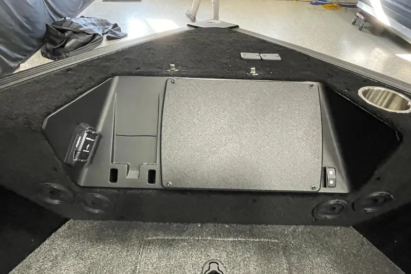 Slide: The Image of Interior view of 2026 Alumacraft Competitor 185X Sport boat, featuring storage compartment. - 12