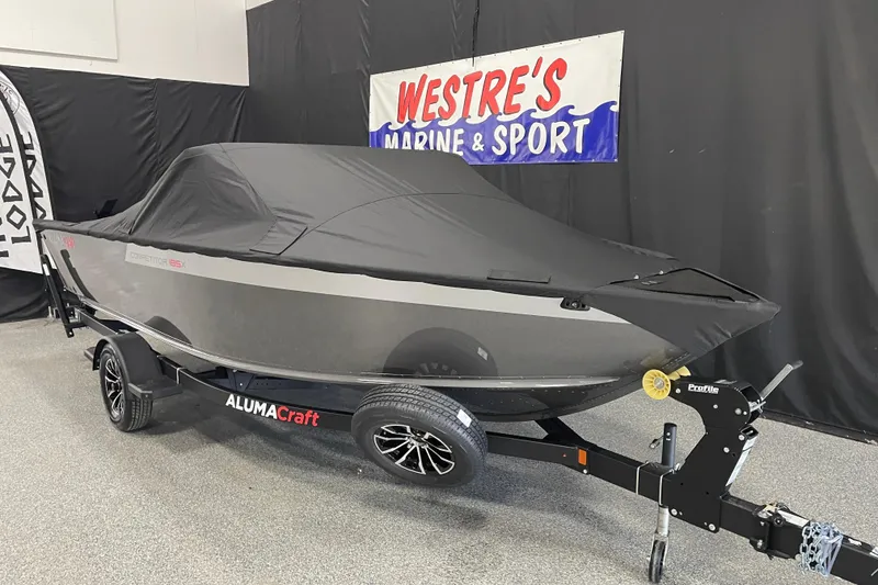 Slide: The Image of 2026 Alumacraft Competitor 185X Sport boat with cover on trailer at Westre's Marine & Sport. - 16