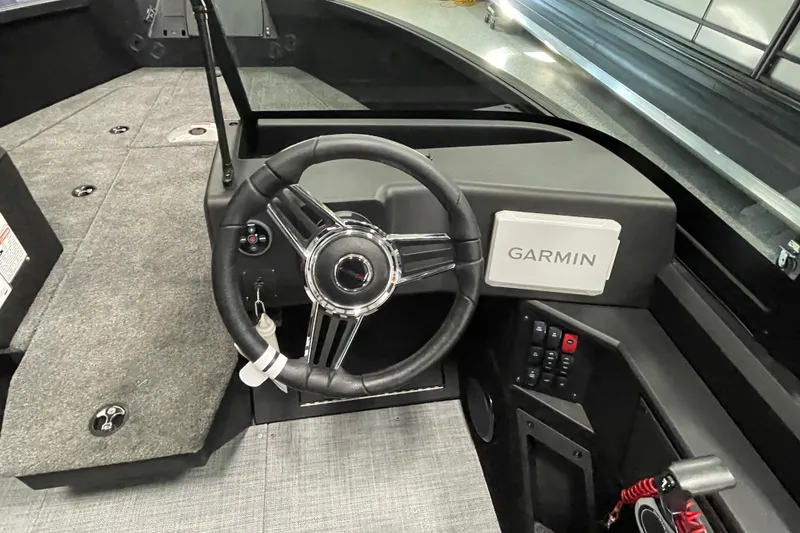 Slide: The Image of 2026 Alumacraft Competitor 185X Sport boat dashboard with Garmin navigation system. - 8