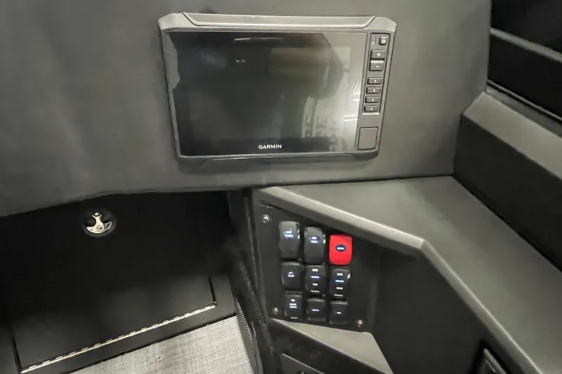 Slide: The Image of 2026 Alumacraft Competitor 185X Sport dashboard with Garmin display and control panel. - 9