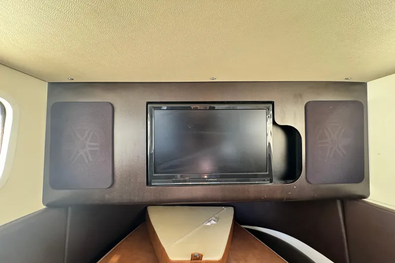 Slide: The Image of Interior of 2019 Scout 355 LXF boat with TV and speakers. - 30