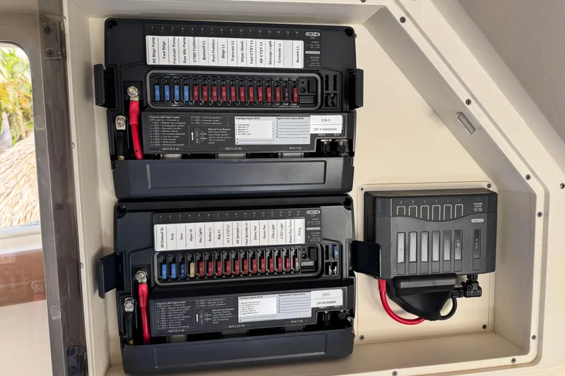 Slide: The Image of Electrical panel of a 2019 Scout 355 LXF boat with labeled circuit breakers. - 31