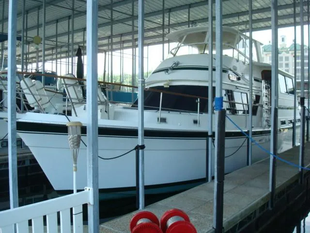 The Image of 1984 Gulfstar 49 Motor Yacht docked in a covered marina. - 0