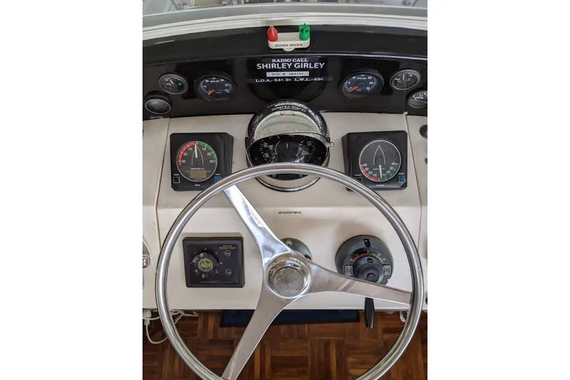 Slide: The Image of 1984 Gulfstar 49 Motor Yacht helm with gauges and steering wheel. - 10