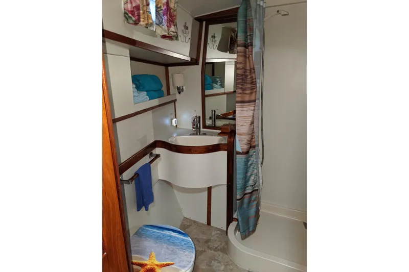Slide: The Image of Bathroom interior of 1984 Gulfstar 49 Motor Yacht with shower and nautical decor. - 104