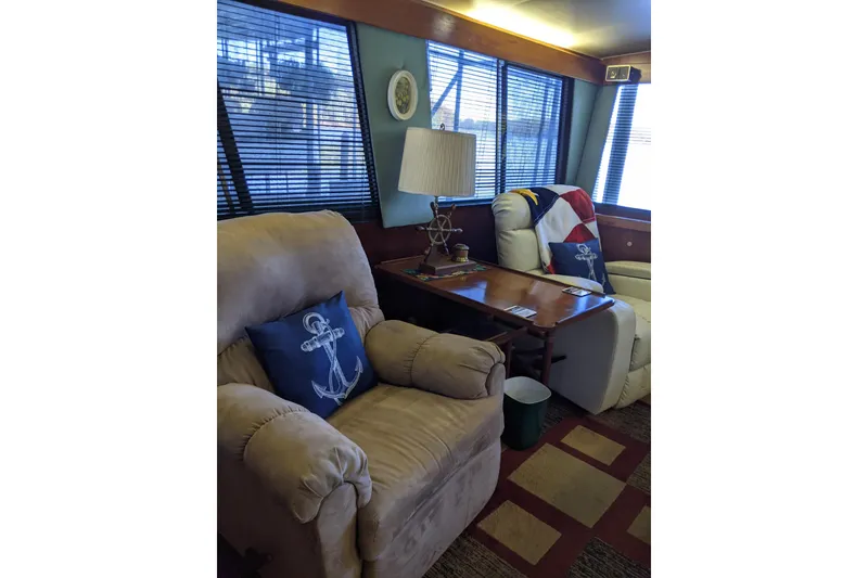 Slide: The Image of Cozy interior of 1984 Gulfstar 49 Motor Yacht with nautical-themed decor. - 19