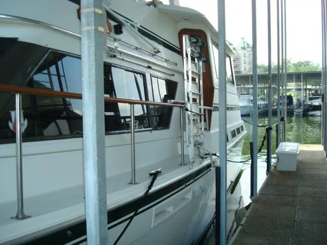 Slide: The Image of 1984 Gulfstar 49 Motor Yacht docked in a marina, side view. - 3