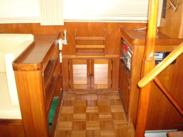 Slide: The Image of Interior of 1984 Gulfstar 49 Motor Yacht with wood paneling and cabinetry. - 30
