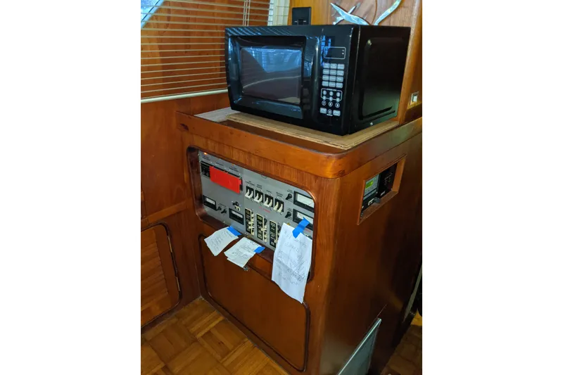 Slide: The Image of Control panel and microwave in 1984 Gulfstar 49 Motor Yacht interior. - 49