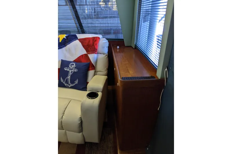 Slide: The Image of Interior of 1984 Gulfstar 49 Motor Yacht with nautical-themed decor and comfortable seating. - 54