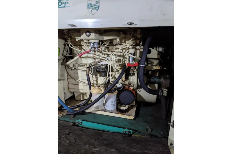 Slide: The Image of Engine compartment of 1984 Gulfstar 49 Motor Yacht with visible wiring and components. - 68