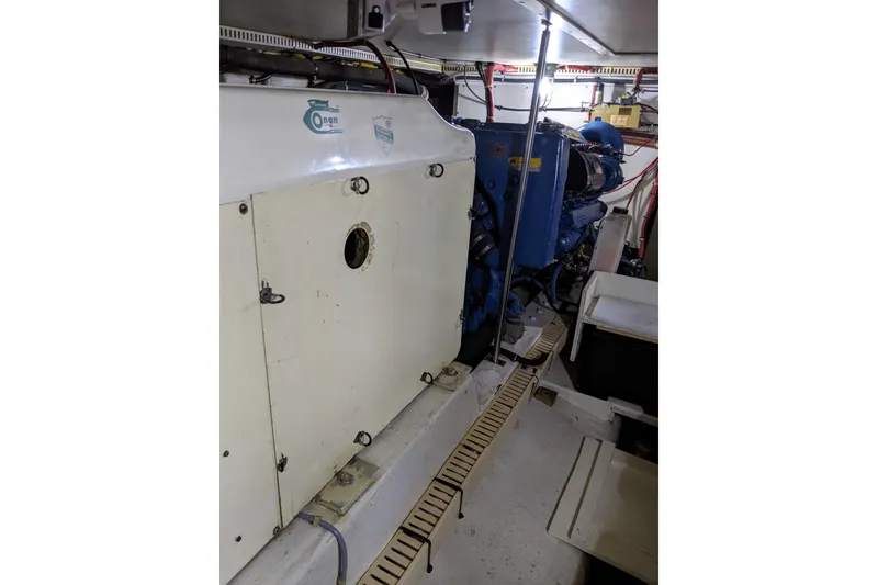 Slide: The Image of Engine room of 1984 Gulfstar 49 Motor Yacht with visible machinery and equipment. - 75