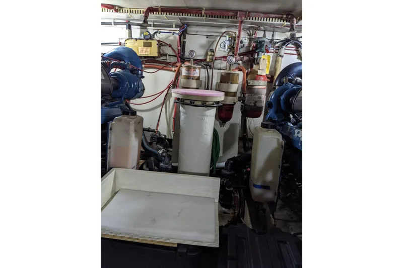 Slide: The Image of Engine room of 1984 Gulfstar 49 Motor Yacht with visible machinery and wiring. - 87