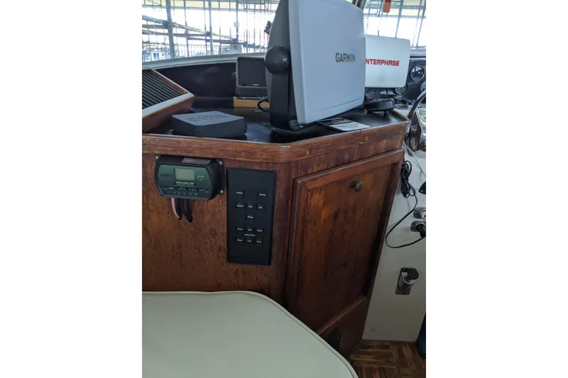 Slide: The Image of 1984 Gulfstar 49 Motor Yacht helm with Garmin and Interphase navigation equipment. - 9