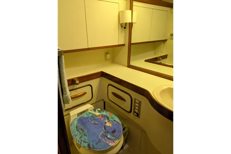 Slide: The Image of Bathroom interior of 1984 Gulfstar 49 Motor Yacht with ocean-themed toilet seat. - 90