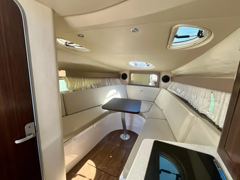 Slide: The Image of 2017 Regal 28 Express cabin interior with seating and table. - 15