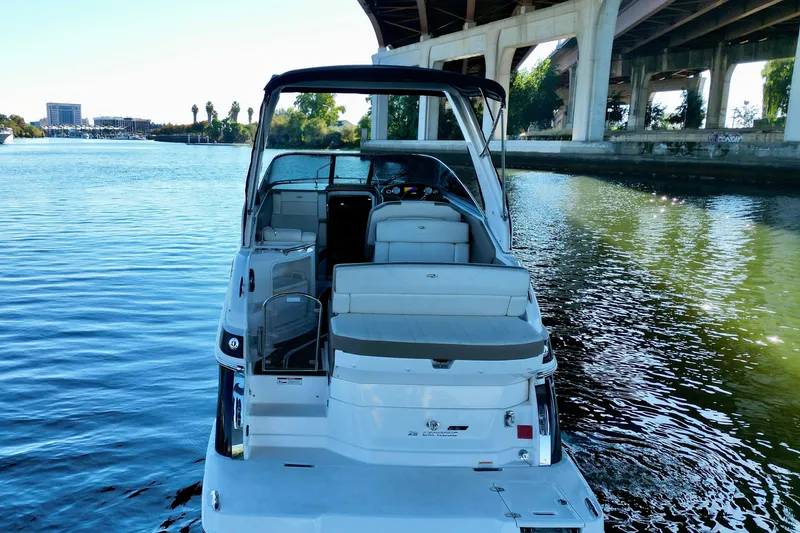 Slide: The Image of 2017 Regal 28 Express boat docked under a bridge on a sunny day. - 4