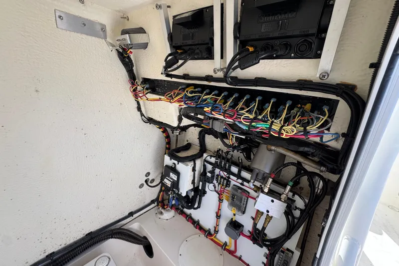 Slide: The Image of 2022 Sea Born LX22 Center Console wiring and electrical components inside the boat. - 28