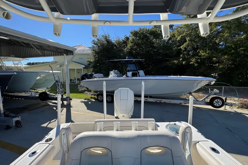 Slide: The Image of 2022 Sea Born LX22 Center Console boat on trailer in sunny outdoor setting. - 33