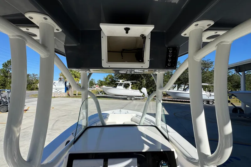 Slide: The Image of 2022 Sea Born LX22 Center Console boat interior with T-top and console view. - 34