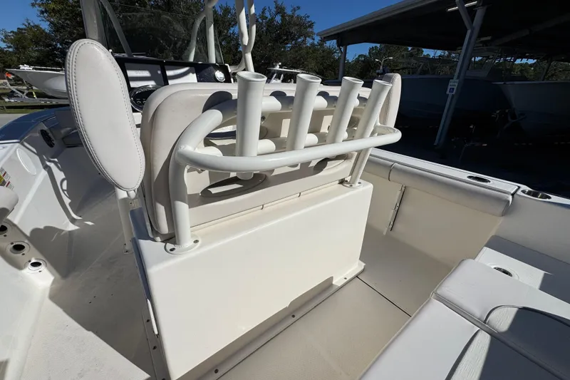 Slide: The Image of 2022 Sea Born LX22 Center Console boat interior with rod holders and seating. - 37