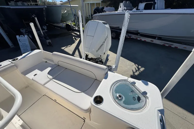 Slide: The Image of 2022 Sea Born LX22 Center Console boat with Mercury engine and seating area. - 39