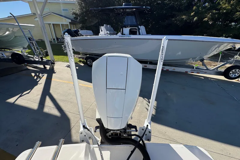 Slide: The Image of 2022 Sea Born LX22 Center Console boat with Power-Pole anchors in a driveway. - 42