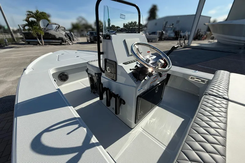 Slide: The Image of 2026 Action Craft 17 FLYFISHER boat interior with steering console and seating. - 10