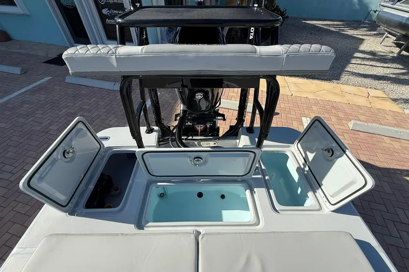 Slide: The Image of 2026 Action Craft 17 FLYFISHER boat with open storage compartments and seating. - 6