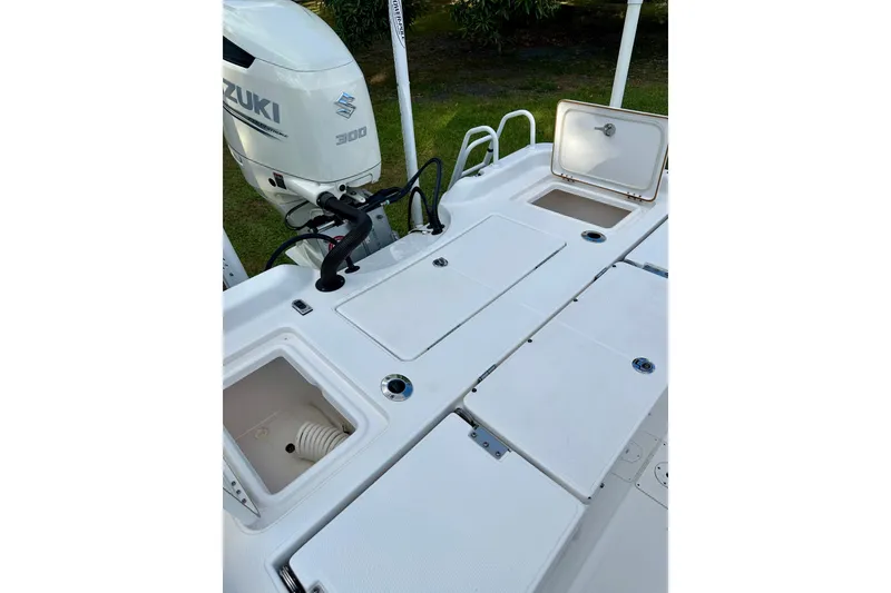 Slide: The Image of 2017 Blue Wave 2400 PureBay boat deck with Suzuki 300 outboard motor. - 16