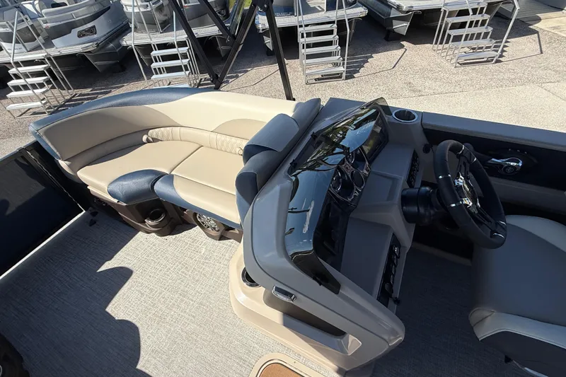 Slide: The Image of 2026 Avalon 2385 LSZ Quad Lounger interior with sleek helm and comfortable seating. - 13