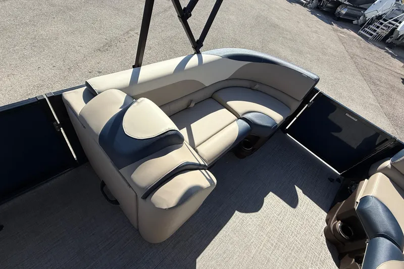 Slide: The Image of 2026 Avalon 2385 LSZ Quad Lounger interior with beige and blue seating, high-performance tri-toon design. - 14