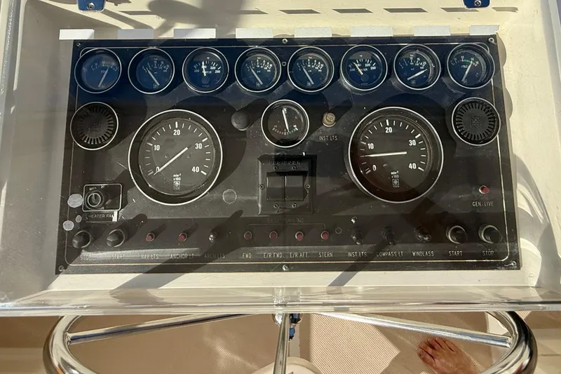 Slide: The Image of Control panel of a 1997 Offshore Yachts 48 Sedan with gauges and switches. - 80