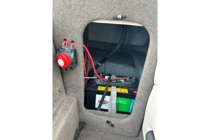 Slide: The Image of Battery compartment of 1999 Bayliner 1850 Capri LS with wiring and switch. - 11