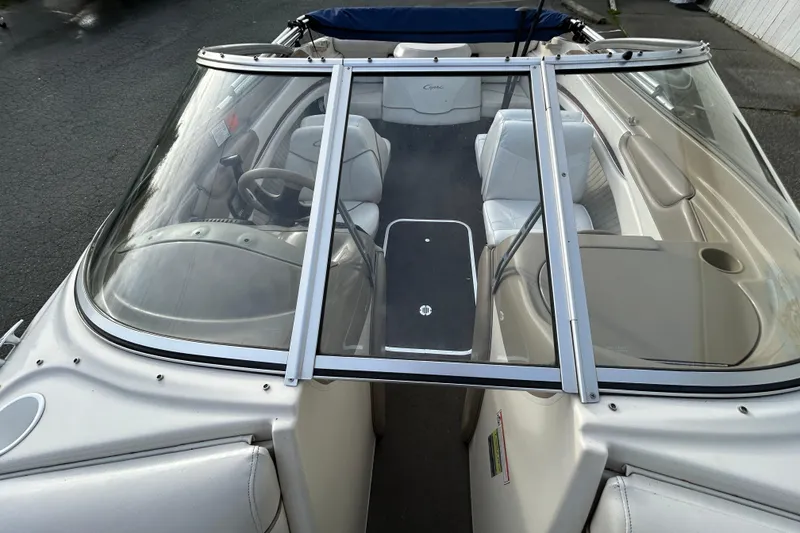 Slide: The Image of 1999 Bayliner 1850 Capri LS boat interior with seating and steering wheel. - 8