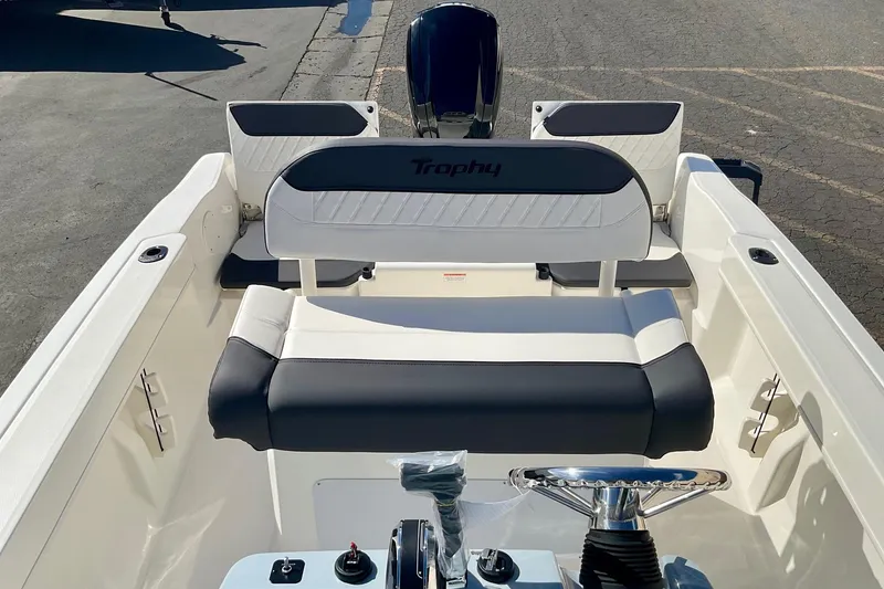 Slide: The Image of 2026 Bayliner Trophy T20CC boat interior with seating and steering wheel. - 12