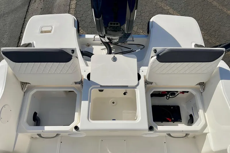 Slide: The Image of 2026 Bayliner Trophy T20CC boat storage compartments and engine view. - 14