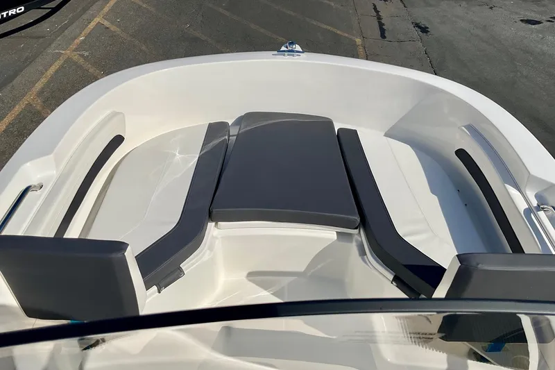 Slide: The Image of 2026 Bayliner Trophy T20CC boat interior with cushioned seating and sleek design. - 21