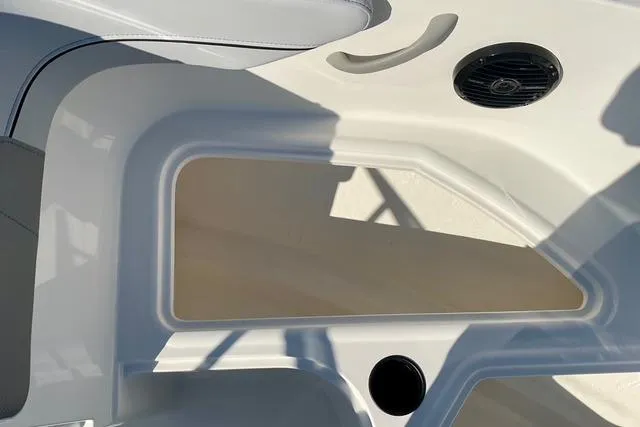 Slide: The Image of 2026 Bayliner VR4 Bowrider OB interior detail with speaker and cup holder. - 11