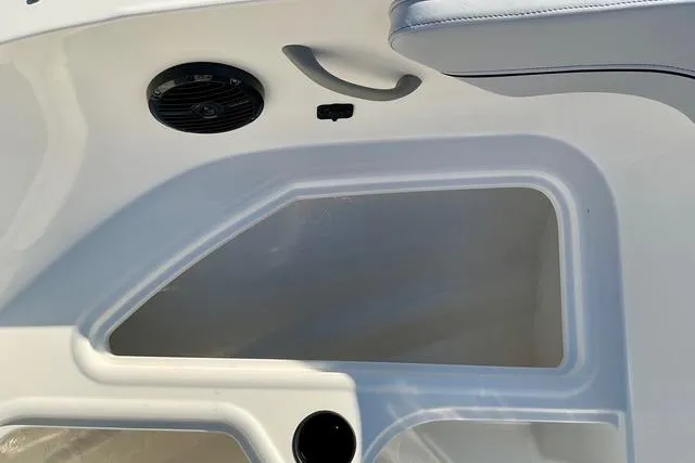 Slide: The Image of 2026 Bayliner VR4 Bowrider OB interior detail with speaker and storage compartment. - 13
