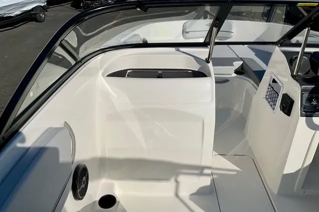 Slide: The Image of 2026 Bayliner VR4 Bowrider OB interior, featuring sleek white seating and modern design. - 16