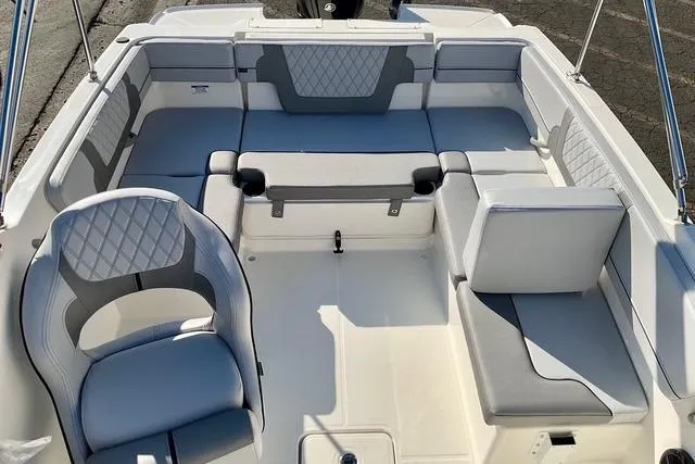 Slide: The Image of 2026 Bayliner VR4 Bowrider OB interior with gray and white seating arrangement. - 9