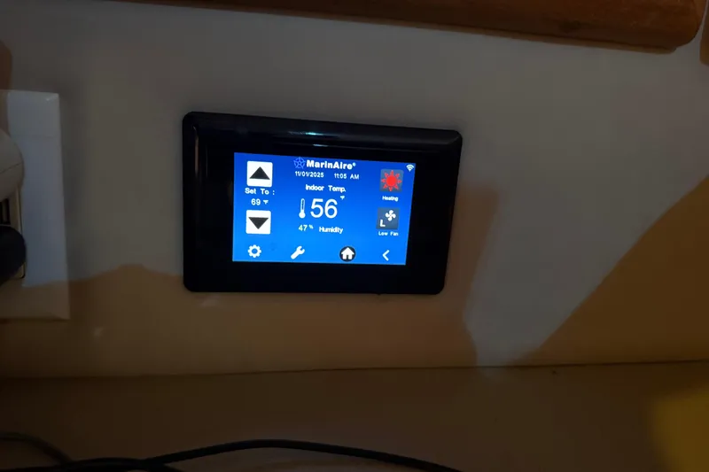 Slide: The Image of Digital thermostat display on 1996 Sea Ray 330 Sundancer boat, showing temperature and humidity. - 17