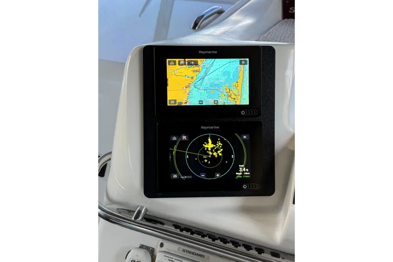 Slide: The Image of Raymarine navigation system on 1996 Sea Ray 330 Sundancer boat dashboard. - 7