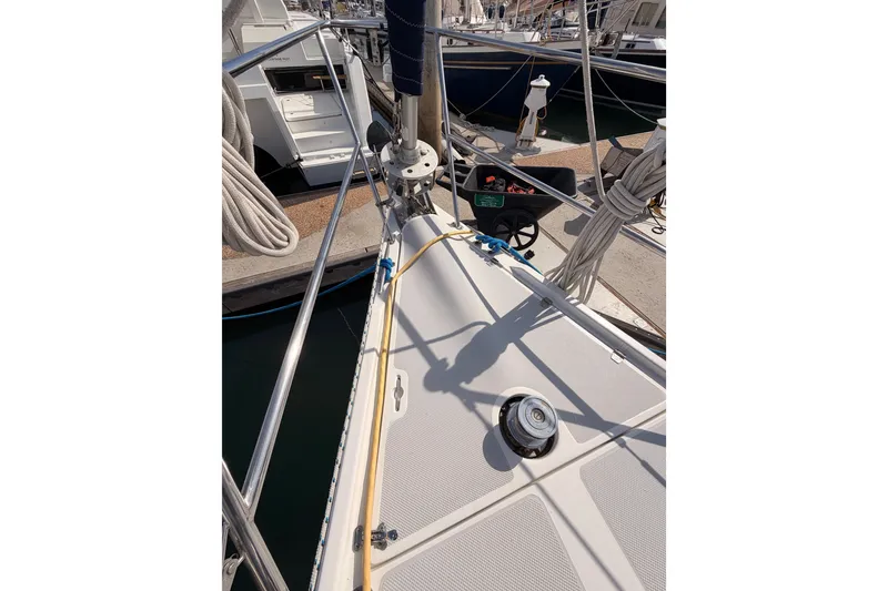 Slide: The Image of 2005 Catalina 42 MkII sailboat deck with winch and rigging at marina. - 14